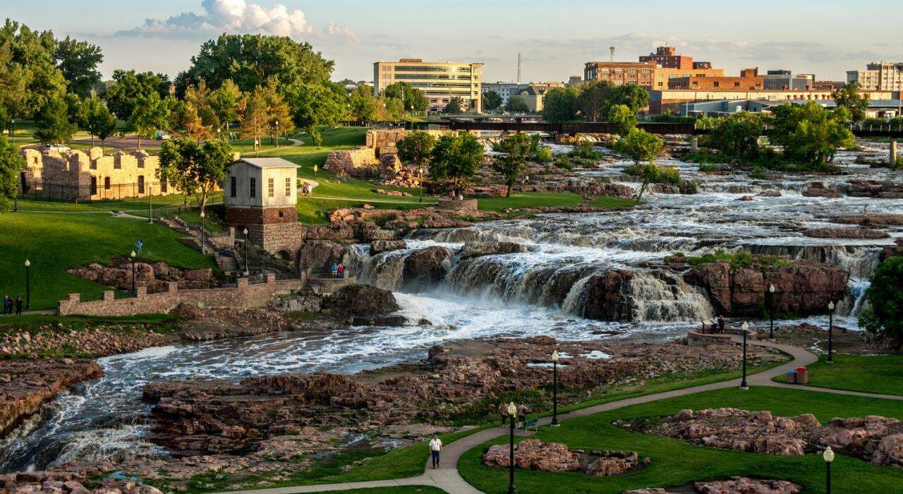 Falls Park in Sioux Falls with the downtown skyline beyond the Big Sioux River