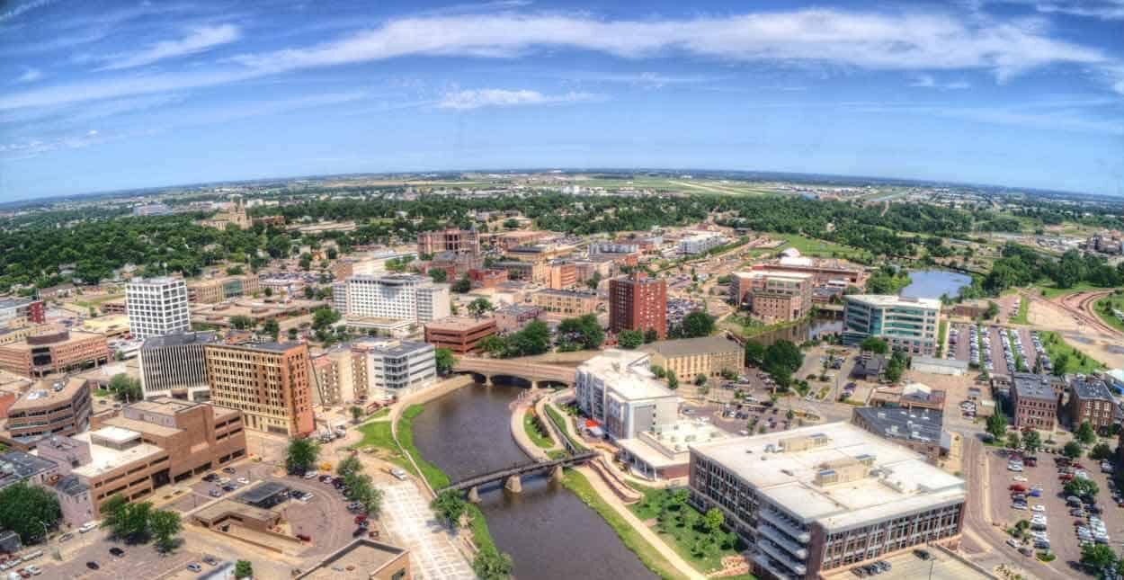 Aerial view of Falls Park with downtown Sioux Falls beyond — the centerpiece of the city's park system